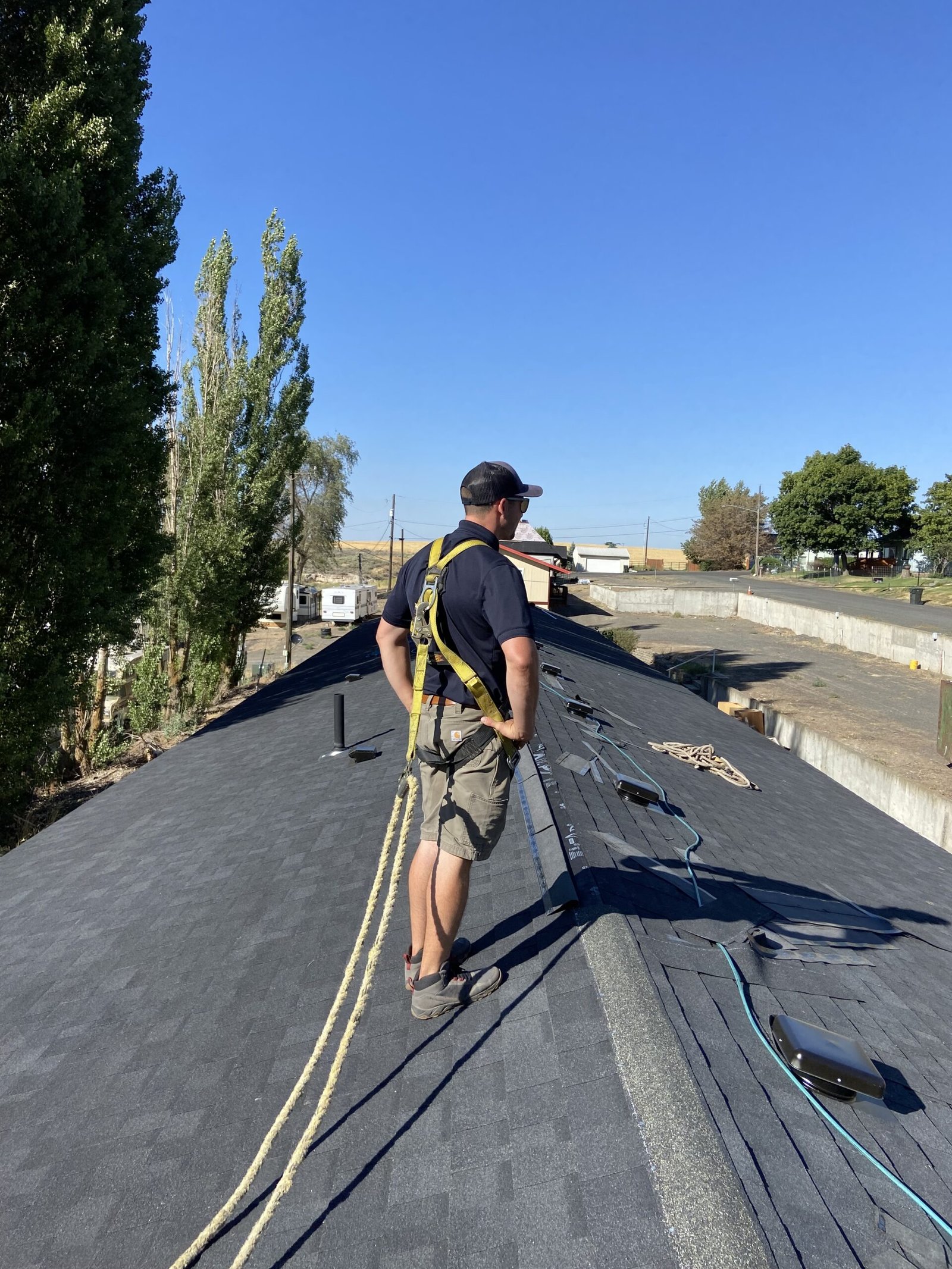 RC Roofing crew prepping the job site for a roof repair