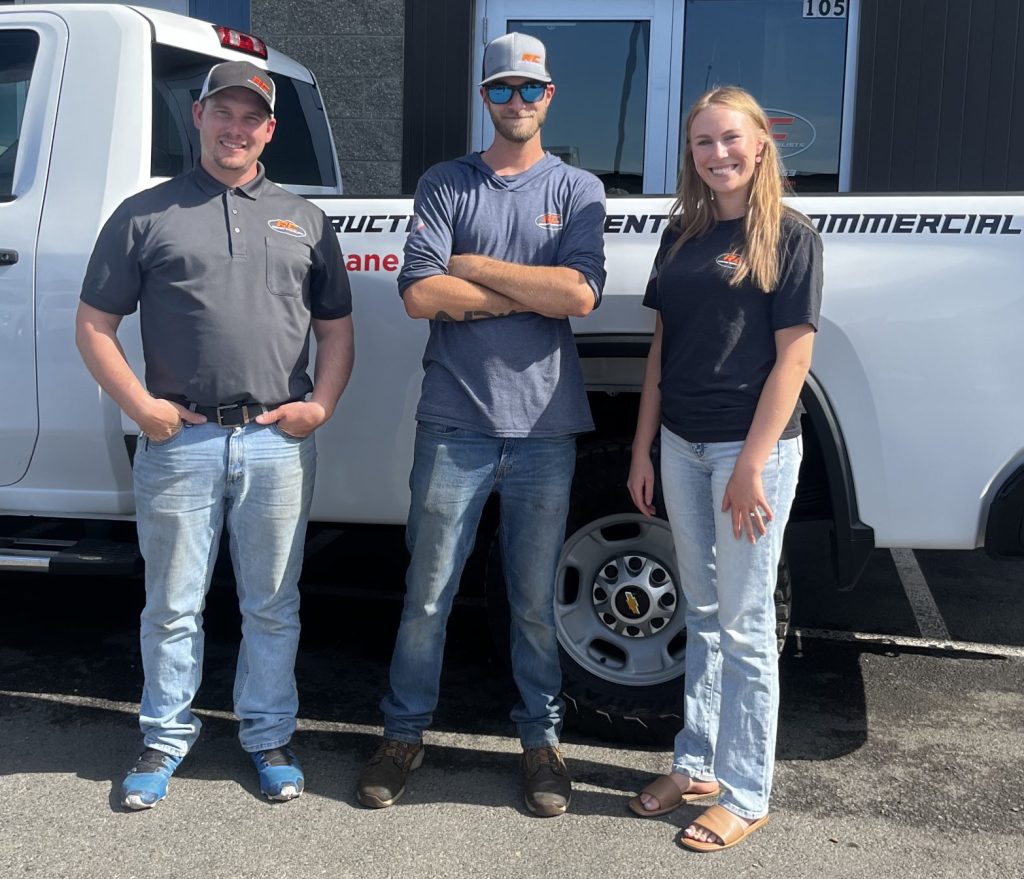 RC Roofing team stands outside together for a picture