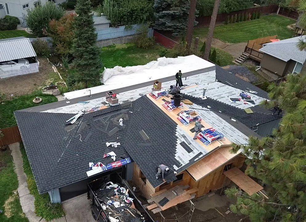 full roof replacement and installation being completed by RC roofing specialists local team