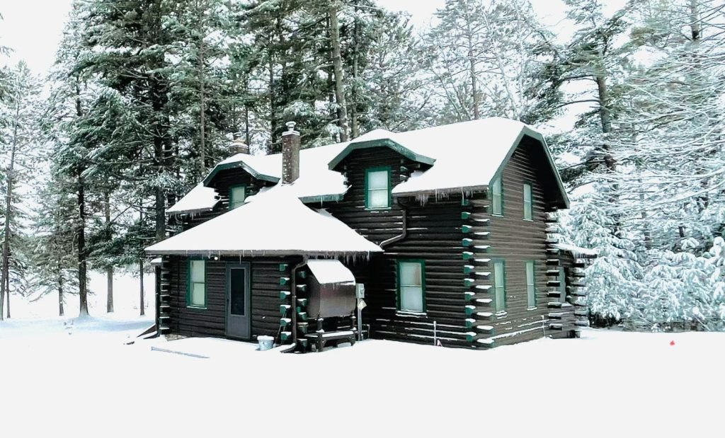 roof with snow on it showing what a winter roof repair in spokane might look like